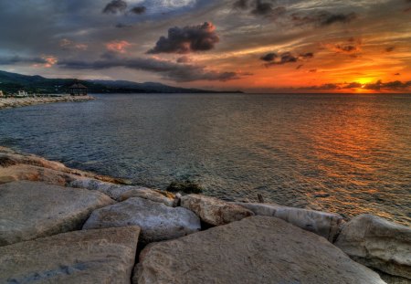 sunset on a rocky shore - clouds, shore, sunset, sea, rocks