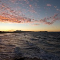 gentle sea waves at sundown