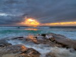 amazing sunset on a rocky shore