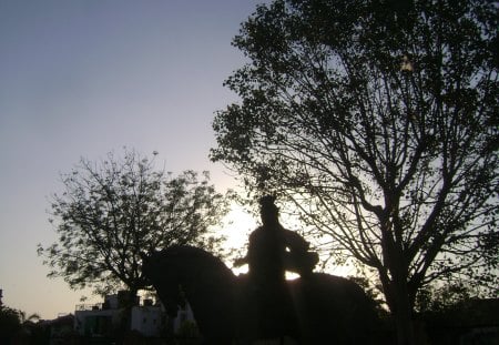 Statue of king riding horse - india, sky, statue, sunlight, horse riding, sunset, blue sky, king, marble temple, indian photography, horse, facebook page, tree, temple, gujarat