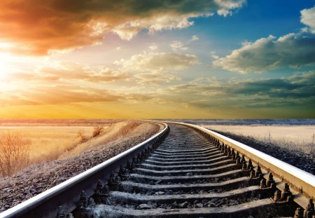 train tracks to the setting sun - clouds, train, tracks, sunset, fields, gravel