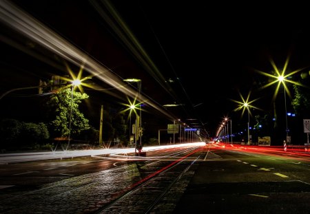 highway with train tracks in long exposure - highway, night lights, train tracks, long exposure