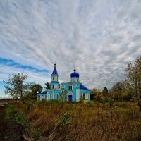 lovely blue orthodox church in the countryside