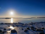 crisp clear sundown on icy bay