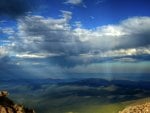 sunbeams over rolling hills