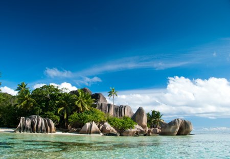 Smooth rocks on the beach - clouds, trees, landscapes, seychelles, sand