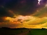 storm clouds over a turbine in the countryside