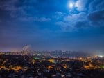 moonlit night over a vast city