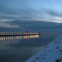 beacons on snowy shore and pier