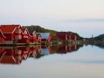 red colored village on the river