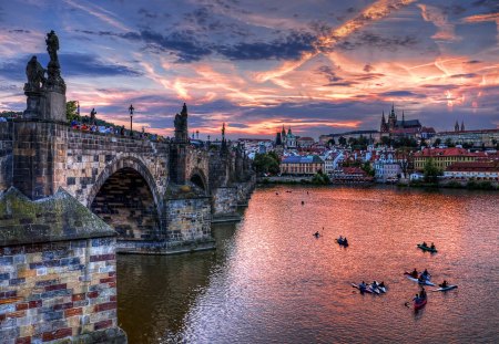 Bridge Going to the Town - clouds, water, architecture, shadow, boats, sunset, nature, lake, houses, sky, bridge