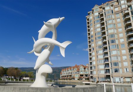 Dry Dolphins - white, water, Okanagan, fountain, blue, Dolphins, buildings