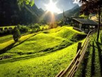 sunbeams on a village in an alpine valley