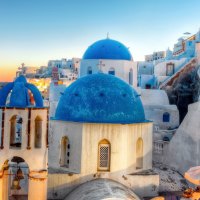 blue domed church on a greek isle