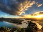 sunset over a village on a peninsula