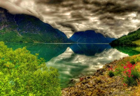 Clear mountain lake - lakeshore, nice, sky, riverbank, greenery, clear, rocks, crystal, pretty, reflection, river, clouds, lake, hills, mountain, shore, peaks, lovely, bushes, nature, cloudy, beautiful, waters, flowers