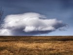 wonderful cloud over field