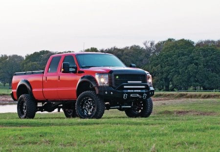 Ranch Truck - red, ford, black rims, lift