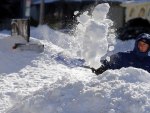 a Person Shoving Snow