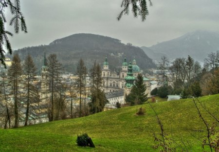 lovely cathedral in a town in a valley - valley, town, cathedral, mountains, grass, mist