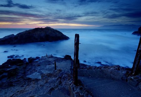 steps down to ruins by a misty sea - shore, mist, sea, dusk, steps, ruins