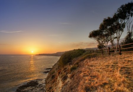 magnificent seashore at sunset - fence, trees, shore, sunset, sea