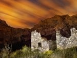 ancient ruins by cliffs under a beautiful sky