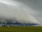 fantastic storm clouds over windmills on farmland