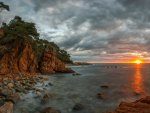 gorgeous sunset over rocky seacoast