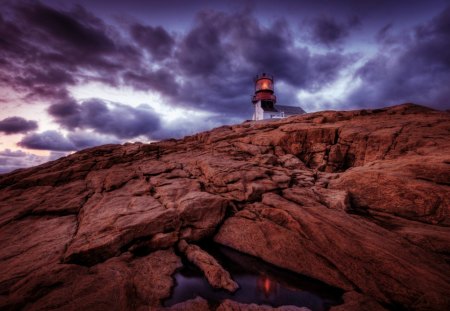 red light lighthouse on rocky shore hdr - lighthouse, clouds, hdr, shore, red light, rocks