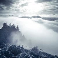 mountain peak above the clouds