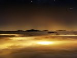 starry sky over a sea of clouds