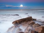 moon over a misty sea