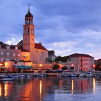 church in a coastal town at sunset