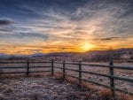 farm fence in the plains at sunset hdr