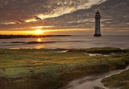 beautiful lighthouse off shore at sunrise - clouds, shore, lighthouse, sea, sunrise