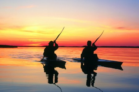 kayaks on the lake at sunset - boats, sunset, men, lake, silhouettes