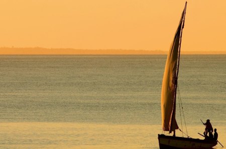 primitive sailboat on golden sea - horizon, men, golden, sea, sailboat