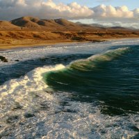 waves crashing on a beach in the canary islands