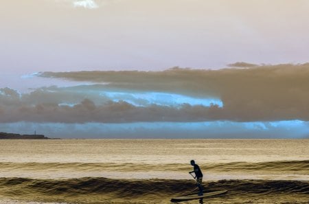 surfing over mellow waves - surfer, sea, waves, clouds