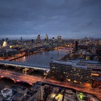 another bridge on a city river in evening