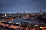 another bridge on a city river in evening