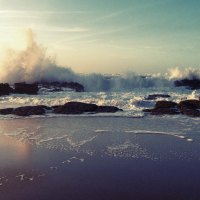 crashing waves on a rocky beach