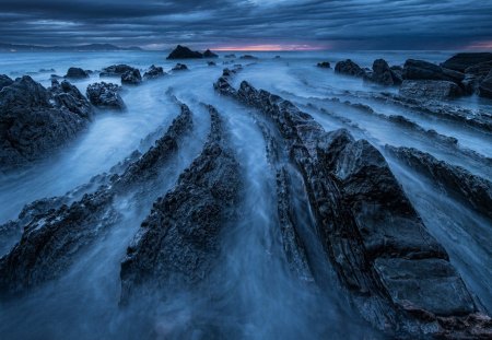 amazing rocky dragon back sea shore - clouds, shore, formation, sea, dusk, rocks