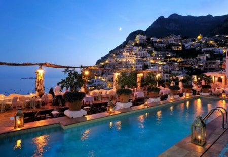 fantastic evening on a greek isle resort - mountain, evening, town, island, pool, sea, resort, lights