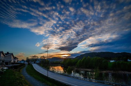 road along a river in suburbia at sunset - road, clouds, river, sunset, suburb