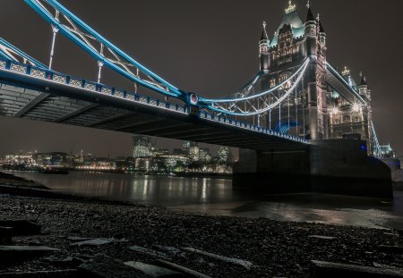 tower bridge in london from the river bank - bank, river, city, bridge, rocks, lights