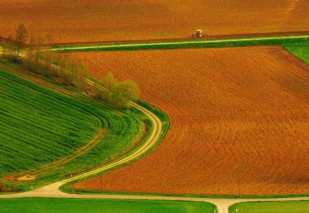 tractor plowing beautiful fields