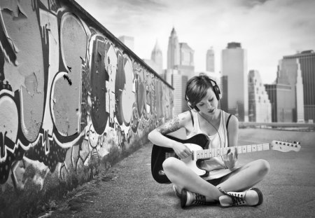 Street Music - town, girl, street, music, guitar, black, instrument, headphones, white, graffity, sitting, wall