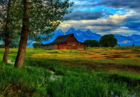 beautiful barn on the plains by a mountain range - clouds, trees, barn, plains, mountains, brook